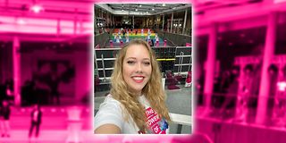 A trainee stands in front of the event backdrop with a wide staircase and tables in the foyer